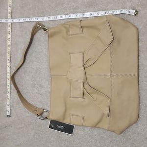 BNWT Alfani tan bag with bow detail on the front orig. $138